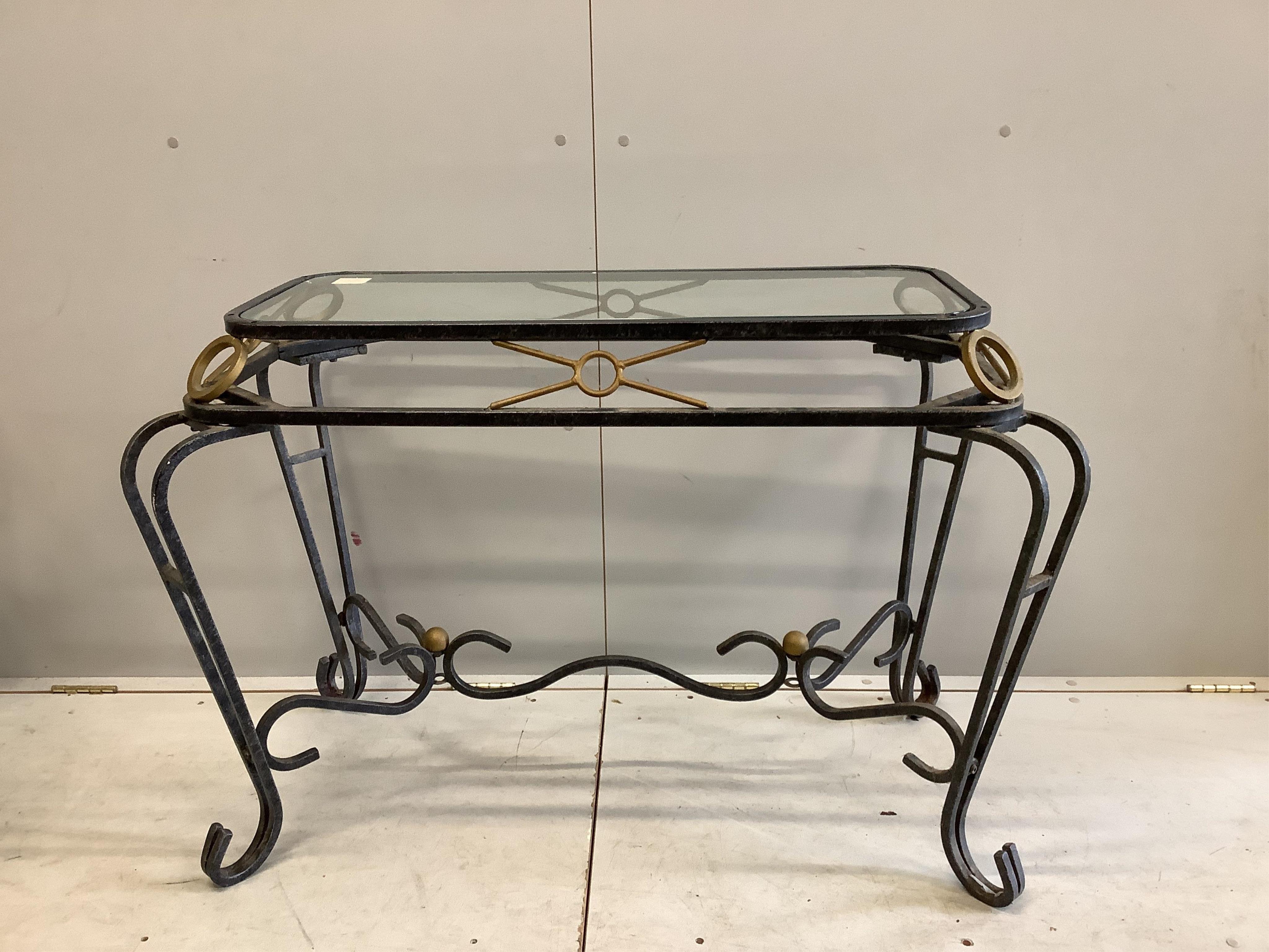 A pair of wrought iron glass top tables, width 106cm, depth 58cm, height 71cm. Condition - fair